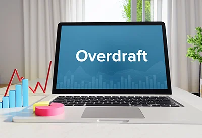 Laptop screen displaying the word Overdraft